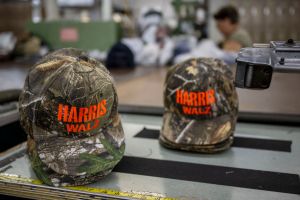 hunters Embroidered campaign hats of US Vice President and Democratic presidential candidate Kamala Harris and Minnesota Governor and Democratic vice presidential candidate Tim Walz (Photo by ANGELA WEISS/AFP via Getty Images)